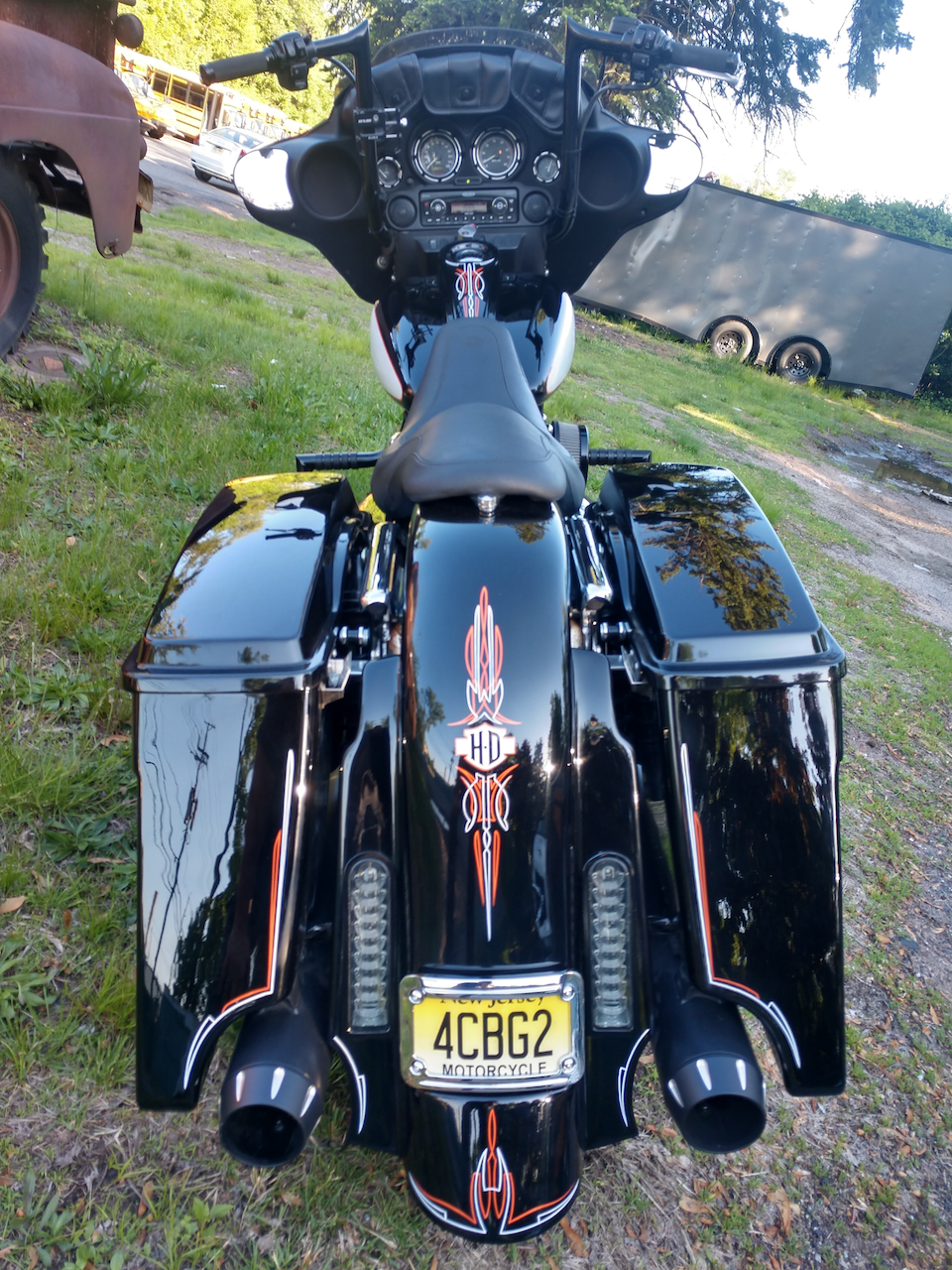 A black motorcycle with a license plate that says 4cbg2
