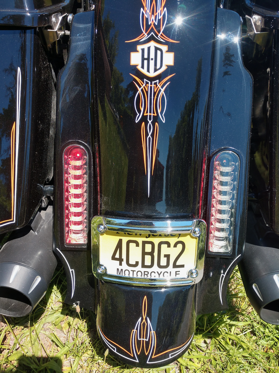 A motorcycle with a license plate that says 4cbg2