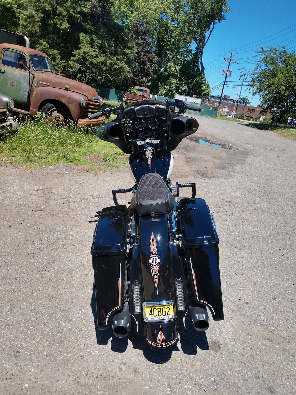 A harley davidson motorcycle is parked on the side of the road