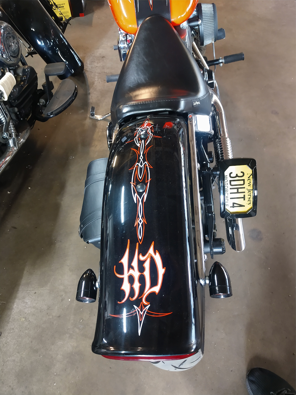 A motorcycle with a license plate that says 30h12