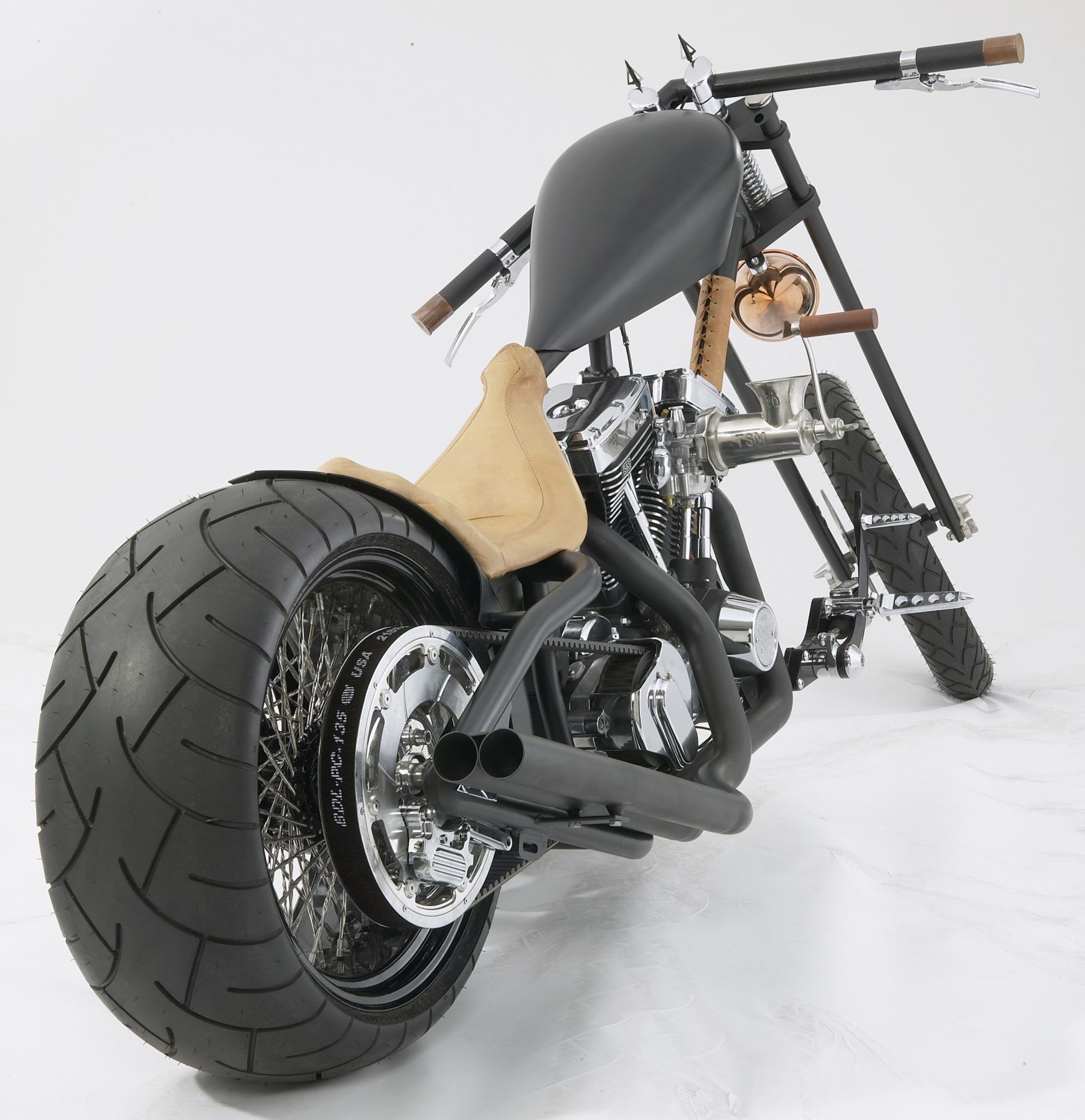 A black motorcycle with a large tire on the back