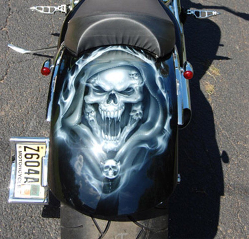 A motorcycle with a license plate that says z6044