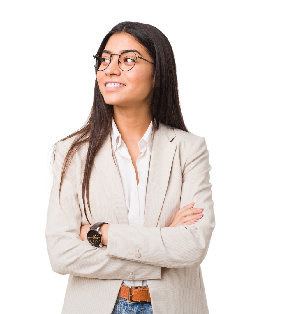 A woman wearing glasses and a suit is standing with her arms crossed and smiling.
