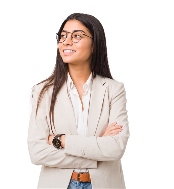 A woman wearing glasses and a suit is standing with her arms crossed and smiling.