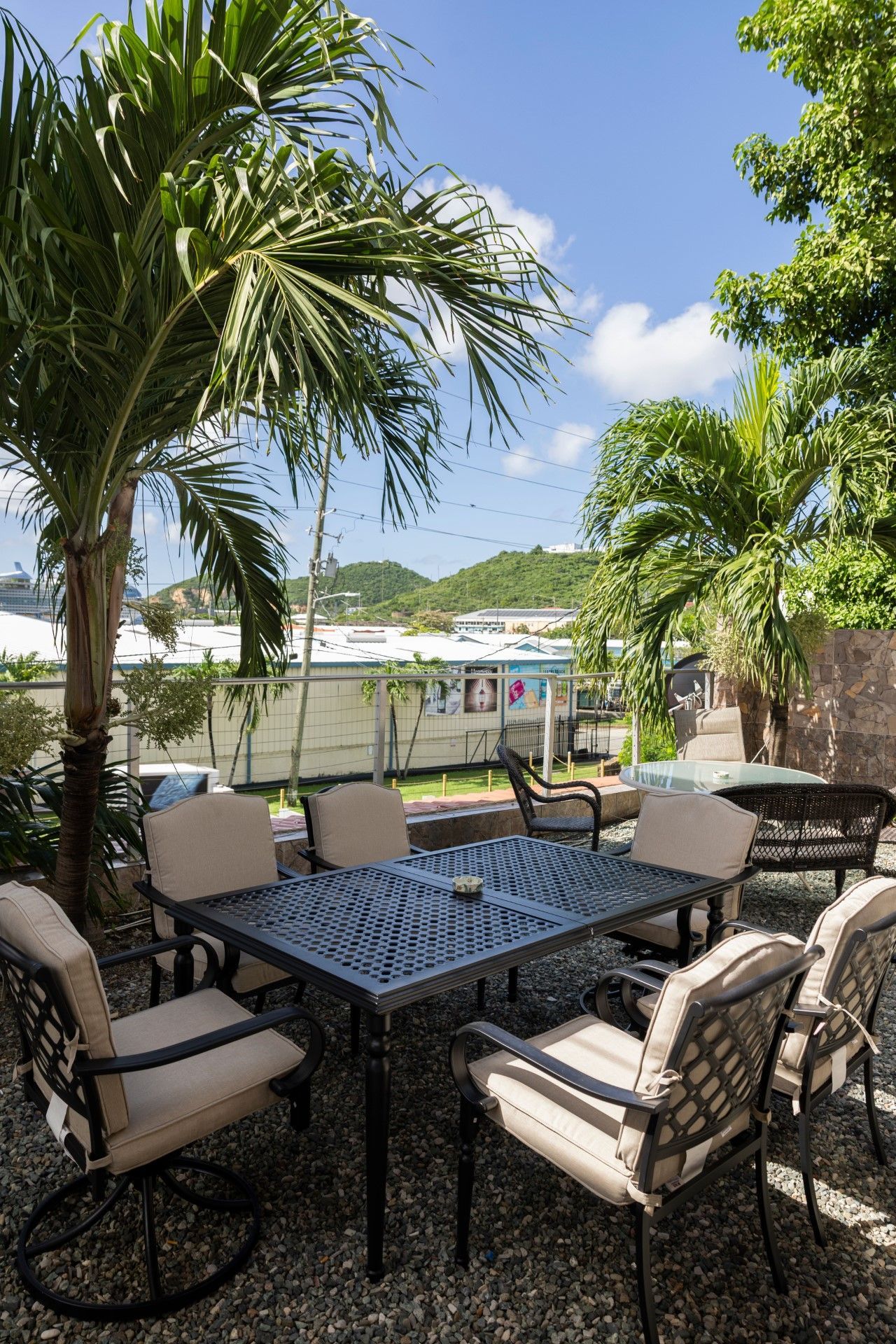 A computer workstation in a room with Texas decor, includes a monitor, keyboard, mouse, and a black office chair.