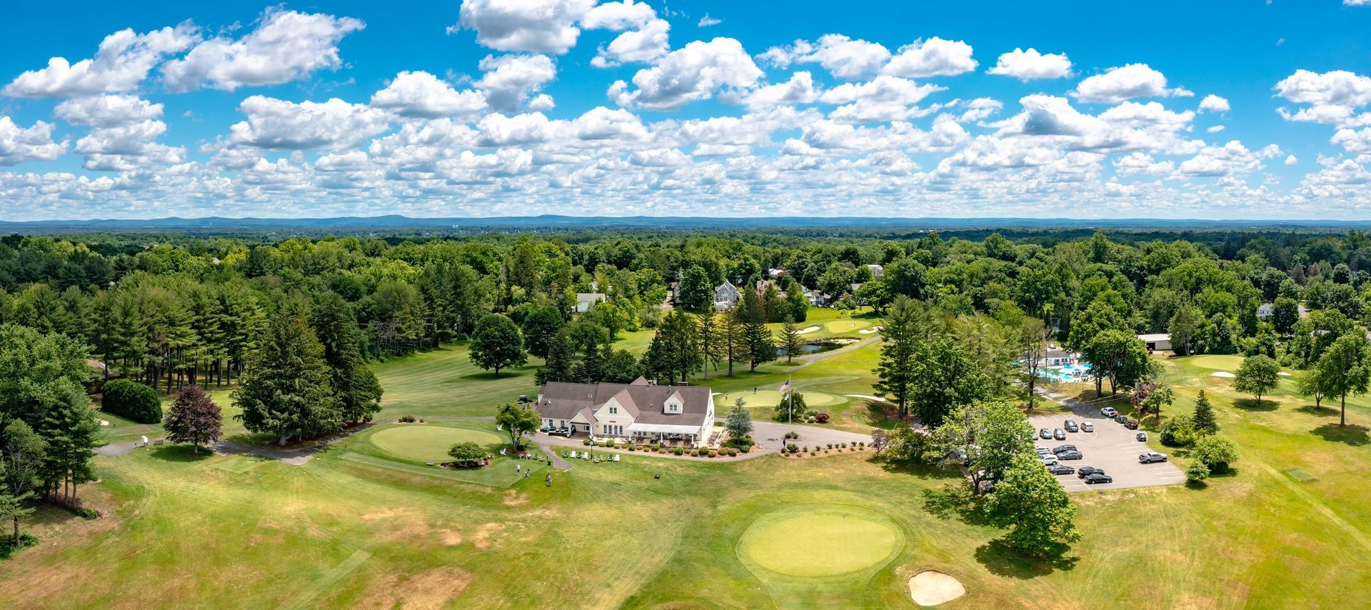 A close-up, angled view of a folded newspaper resting on a wooden surface, with a shallow depth of field.