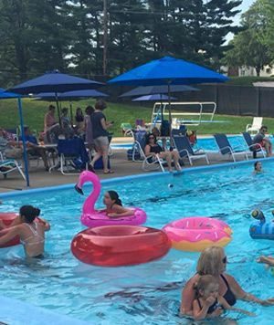 A group of people are playing in a swimming pool