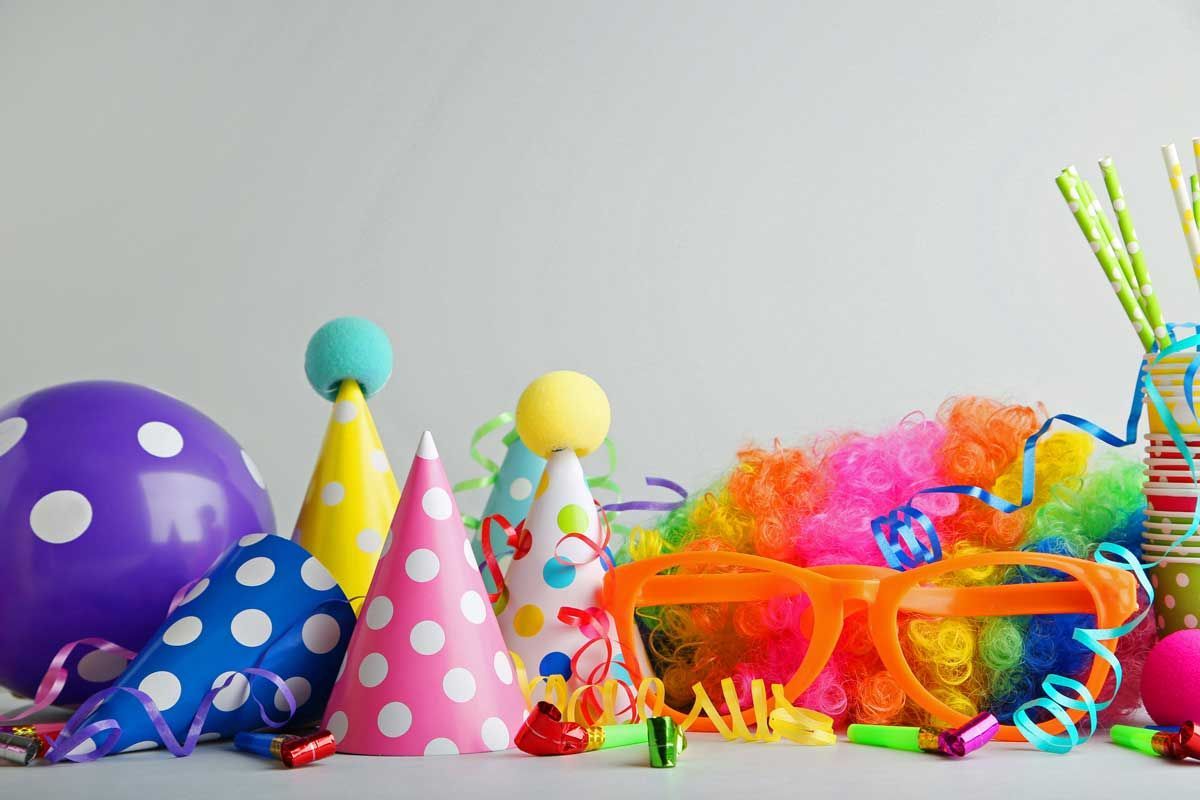 A young boy is playing with foam blocks in a playground.