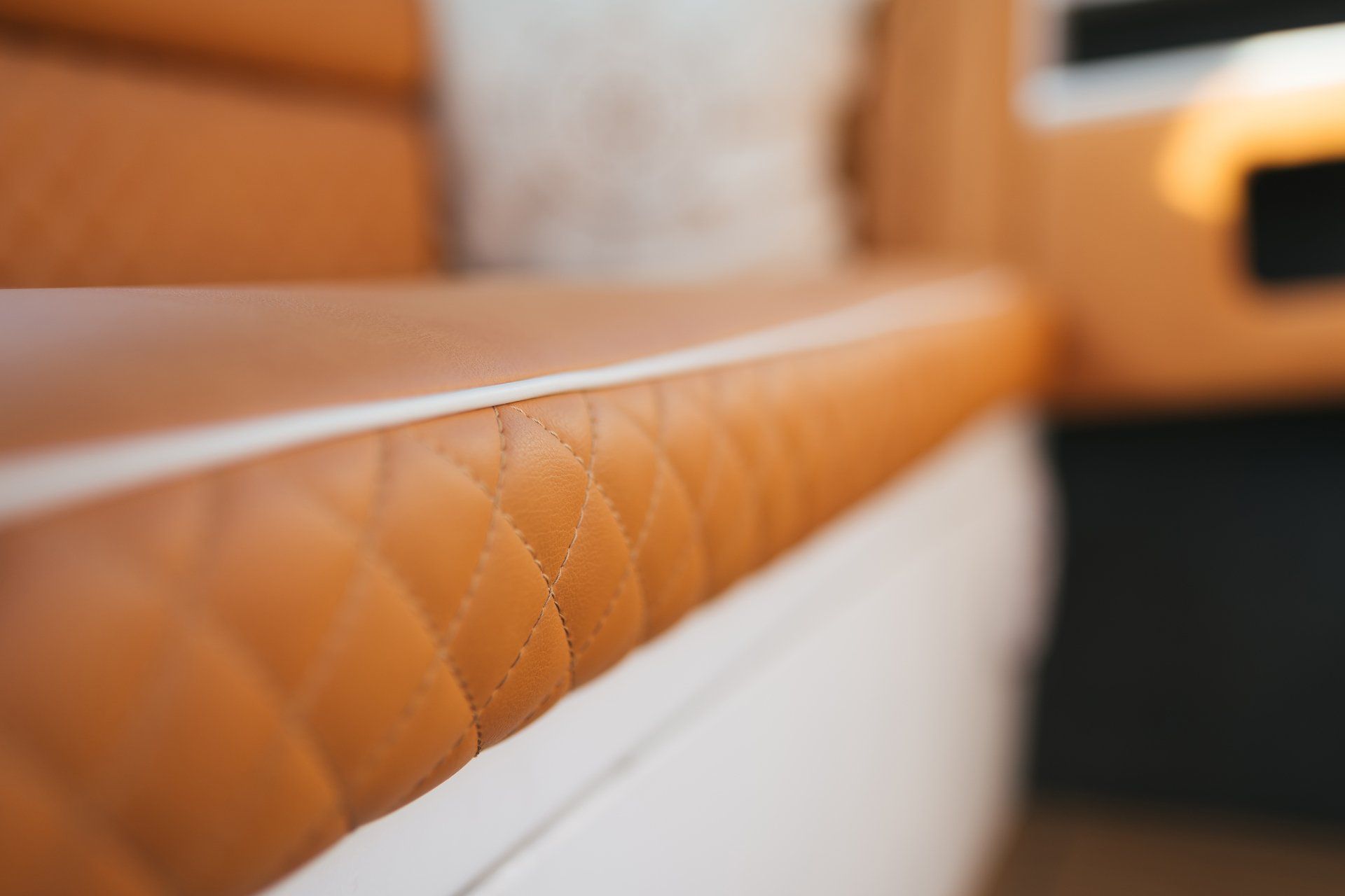 Orange and white upholstery of a seat in a boat