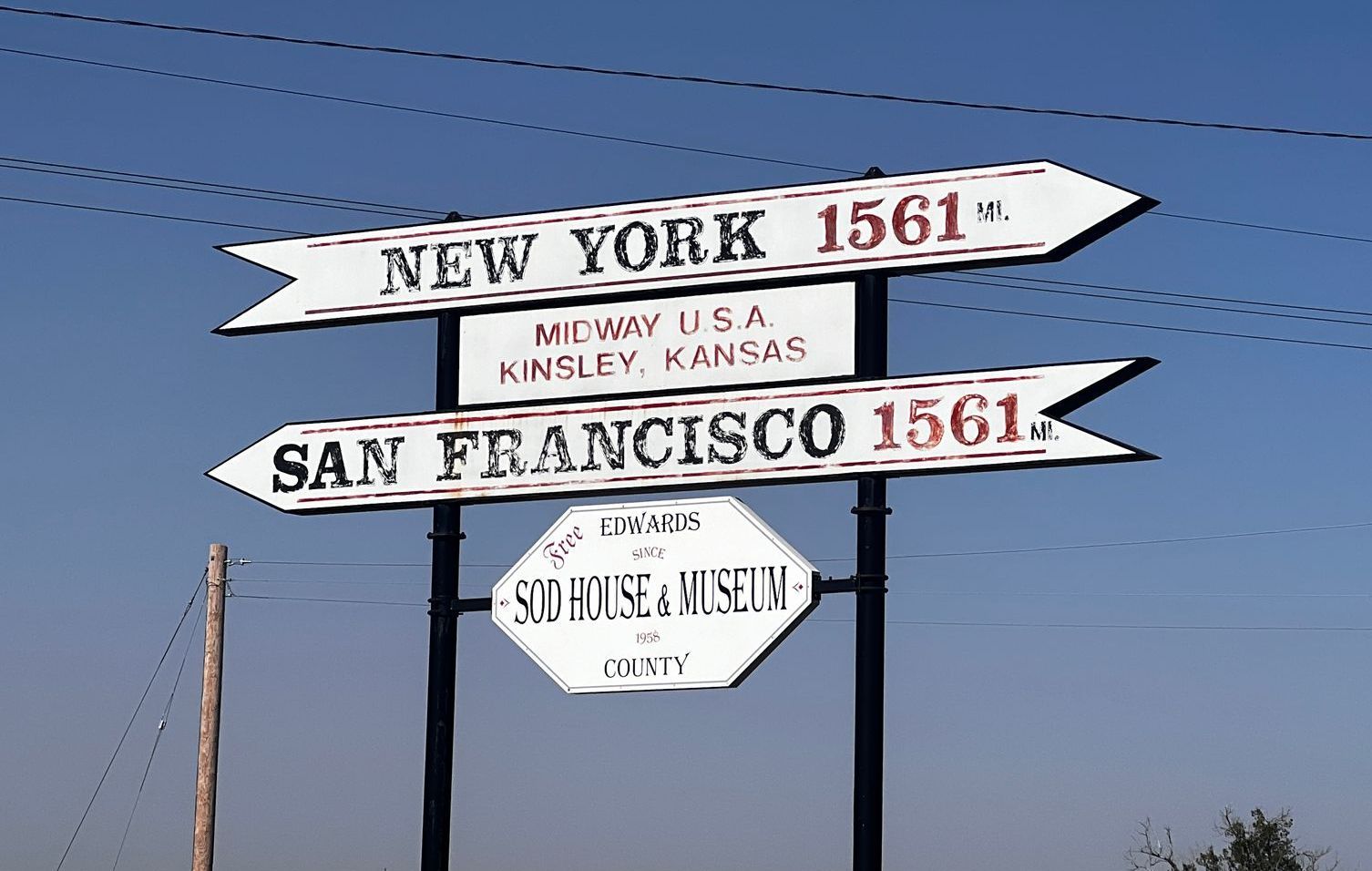 A sign pointing to new york and san francisco