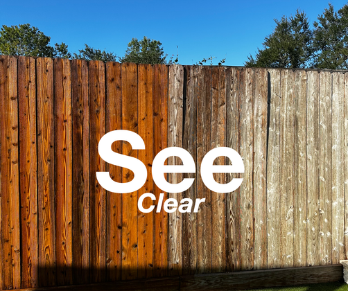 A row of windows reflects a vibrant orange sunset, with the text 