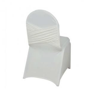 White chair covered with a fitted white slipcover and pleated backrest
