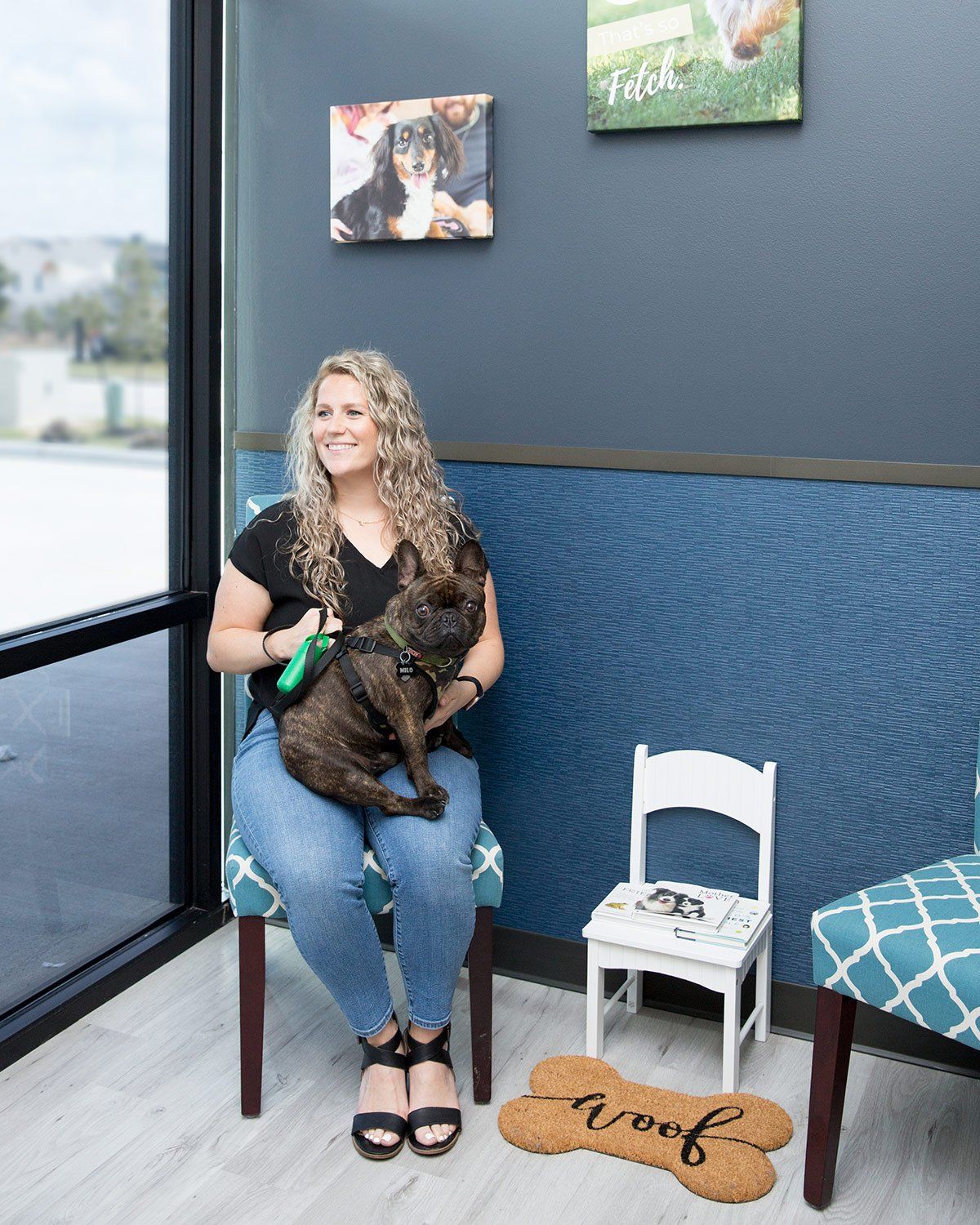Patient in waiting room with her pet dog at A Couple of Vets