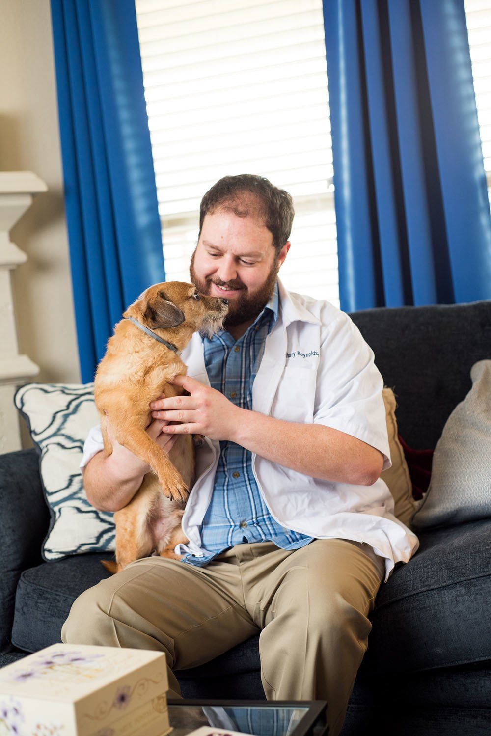 A Couple of Vets owner holding a dog