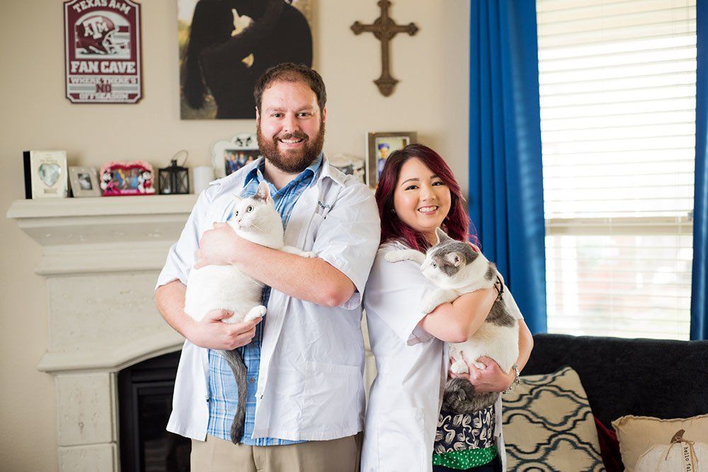 A Couple of Vets owner holding their cats
