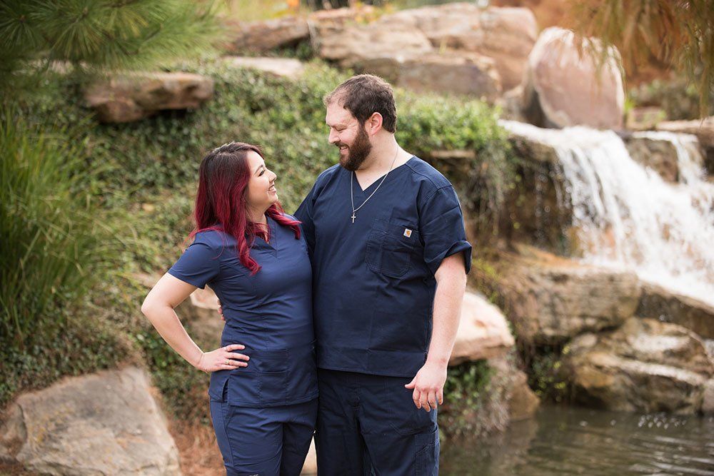 Owners of A Couple of Vets lookking at each other and smiling