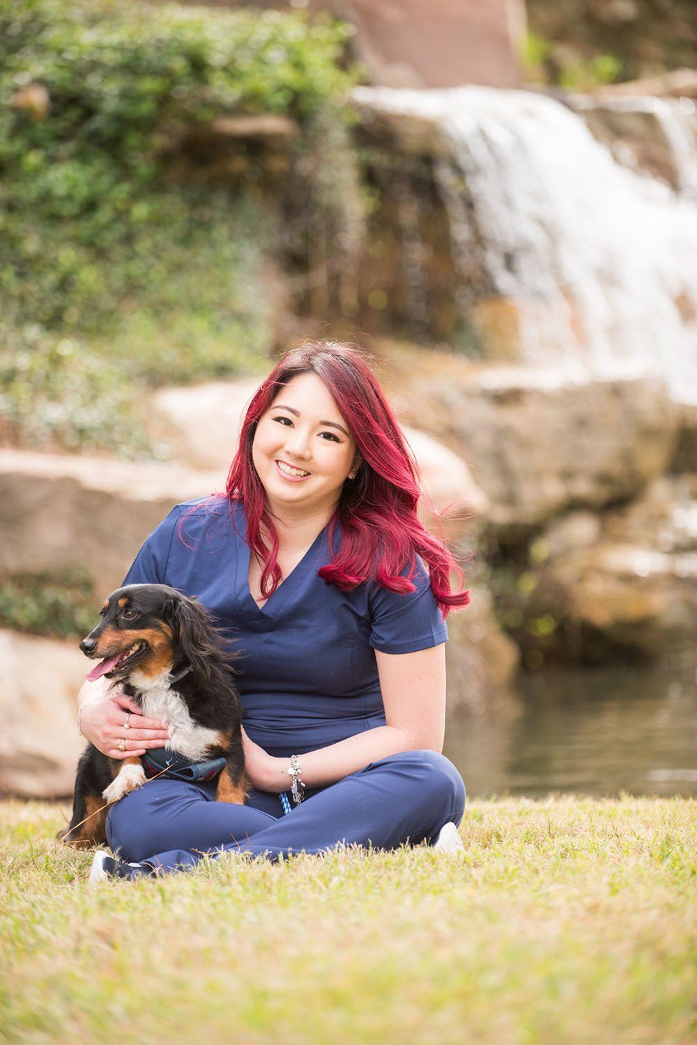 Female owner A Couple of Vets holding a dog outside
