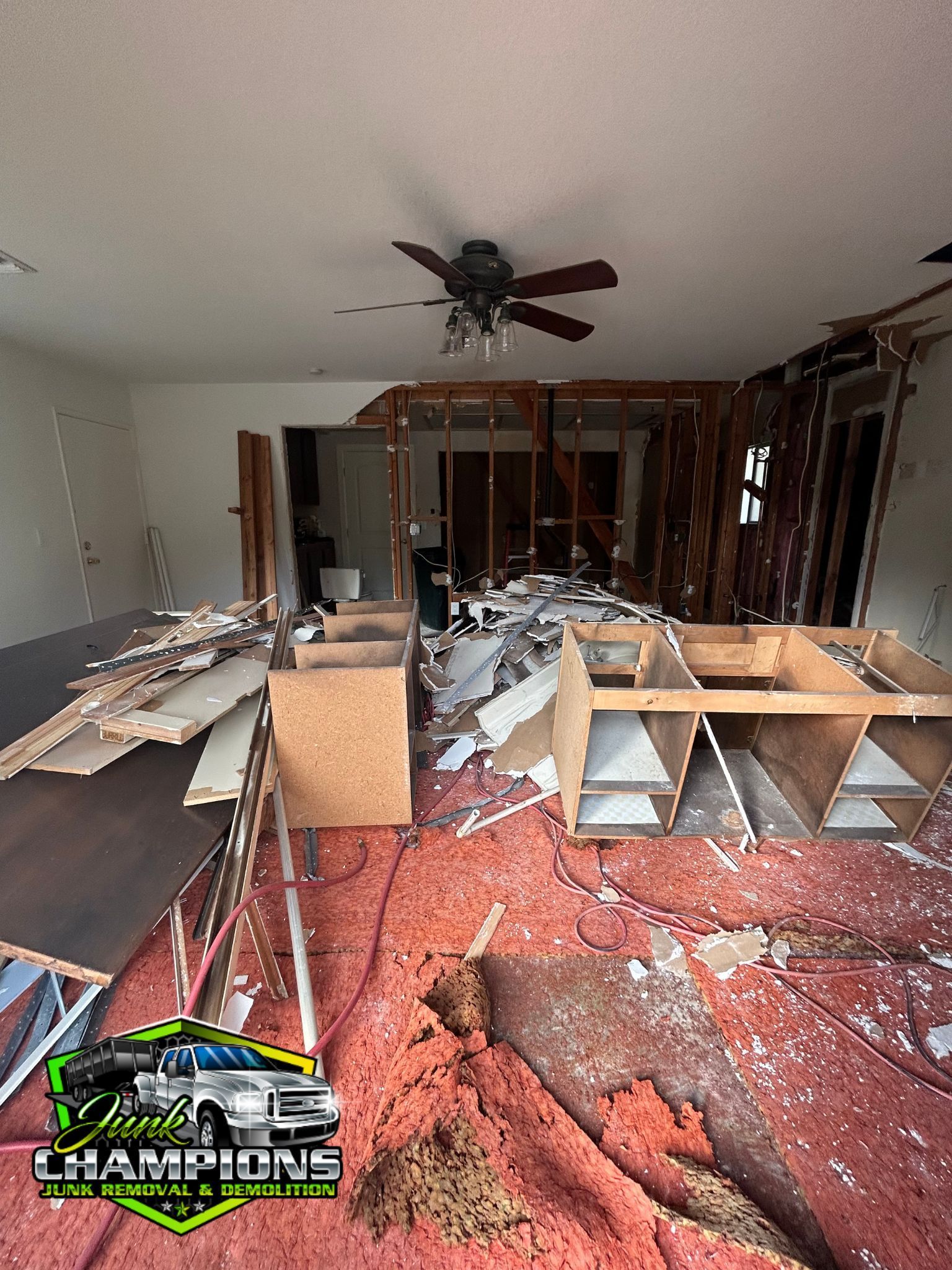 Junk on the floor of a house off of Foothill blvd & Hellman Ave in Rancho Cucamonga about to be removed by the company Junk Champions Junk Removal 