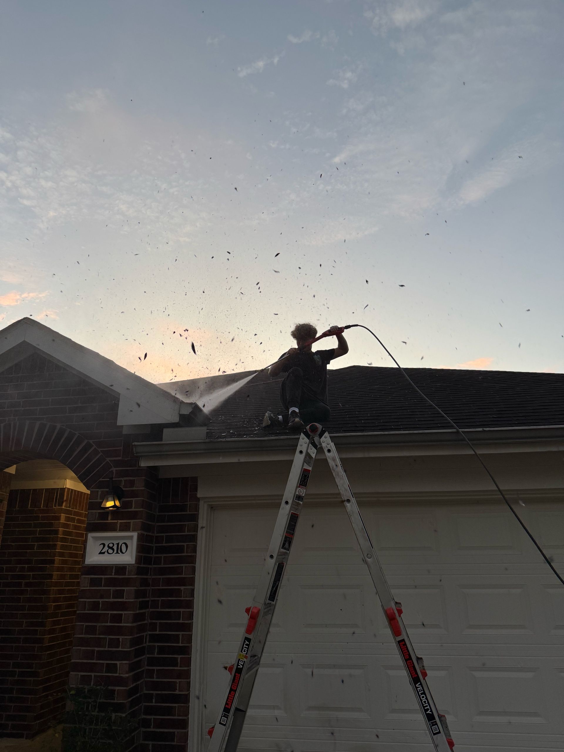 Teen Power Washing Gutter