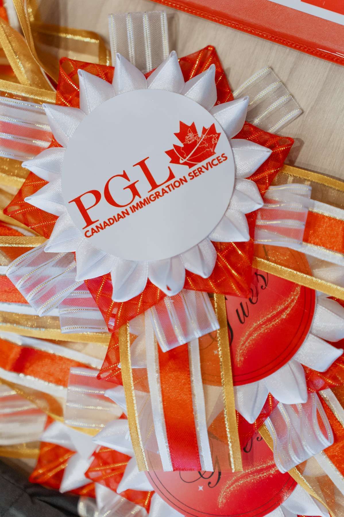 A close up of a canadian immigration services badge