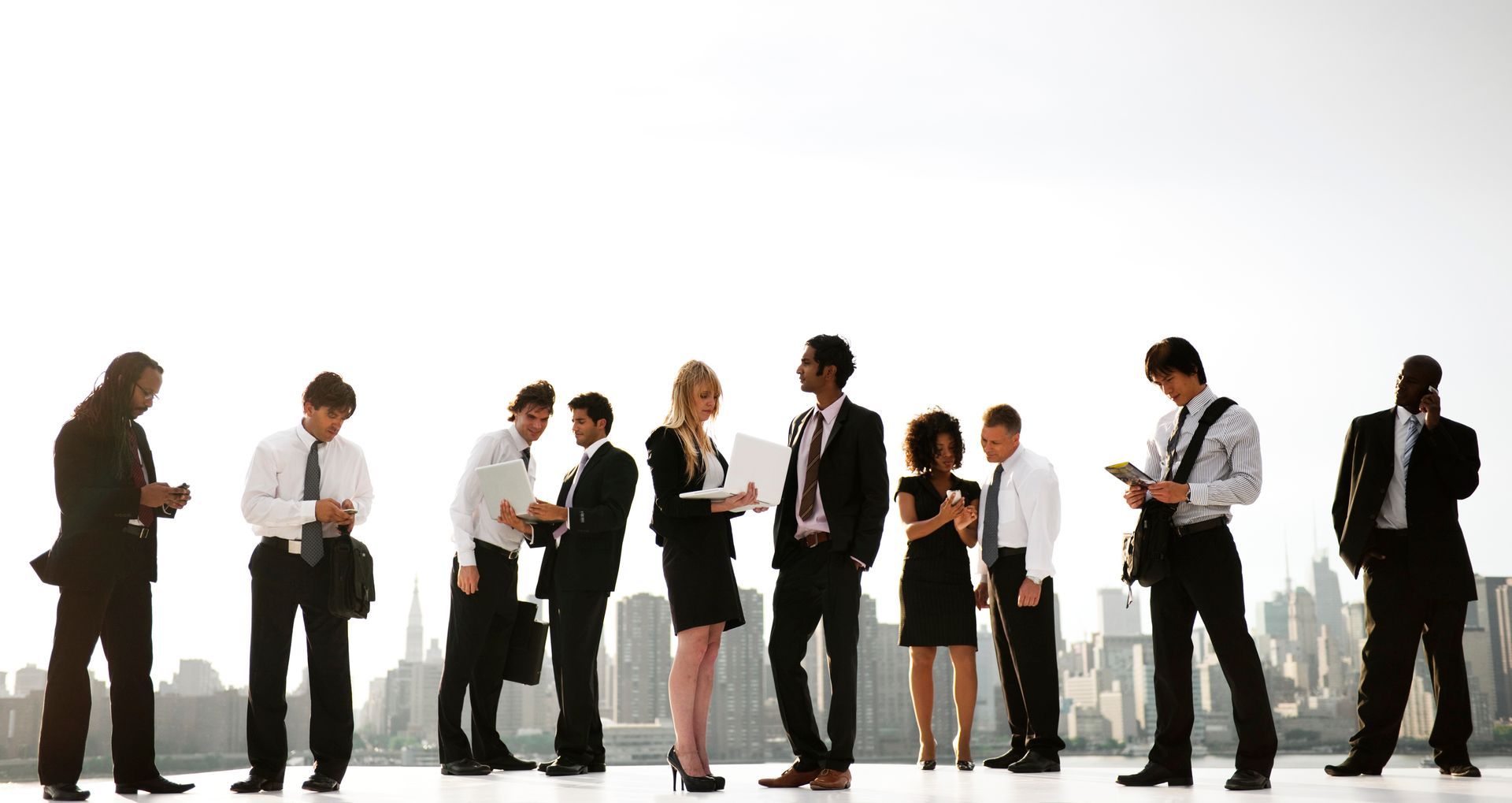 Businesspeople in suits, some interacting, with a cityscape background.