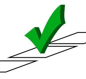 Green checkmark over a checked checkbox.