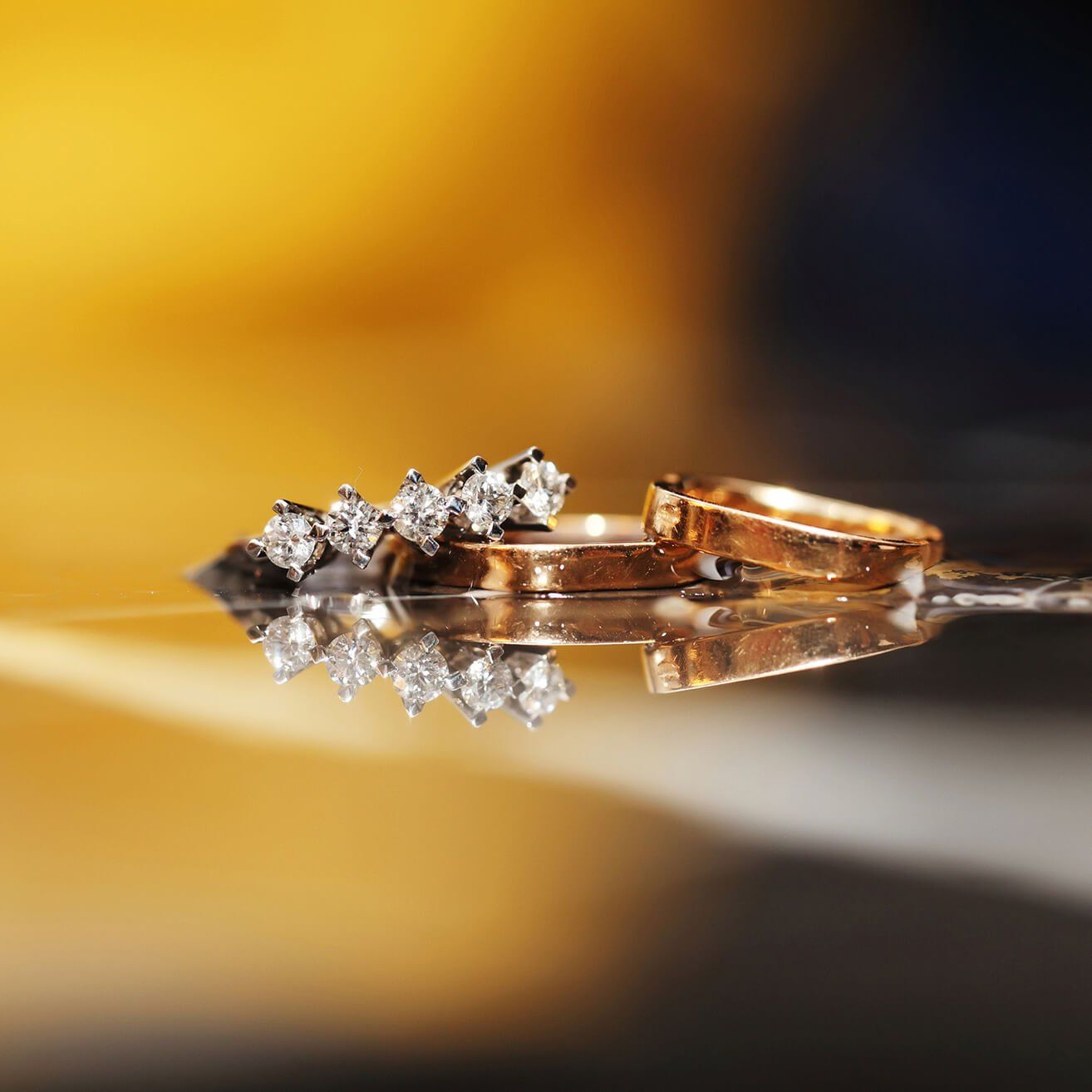 a close up of a pair of wedding rings on a table .