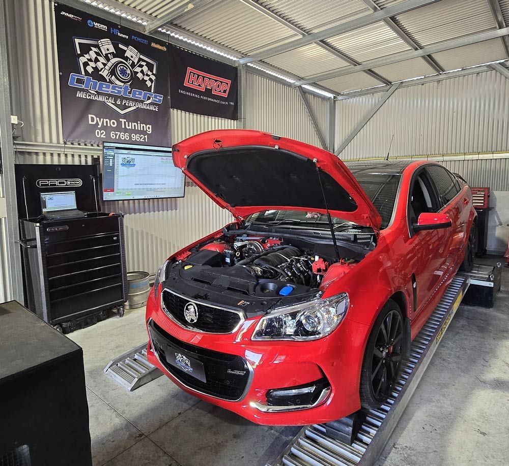 Red Car on a Dynamometer in a Garage — Chester's Mechanical & Performance in Tamworth, NSW
