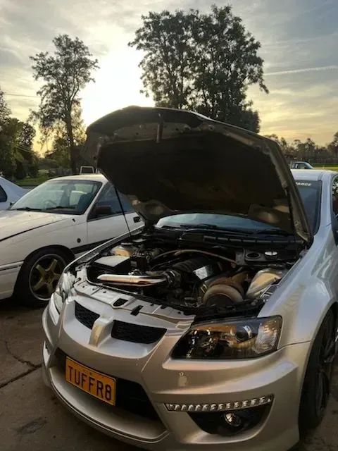 Silver Car With Hood Open, Parked Next to White Car, Outdoors — Chester's Mechanical & Performance in Tamworth, NSW