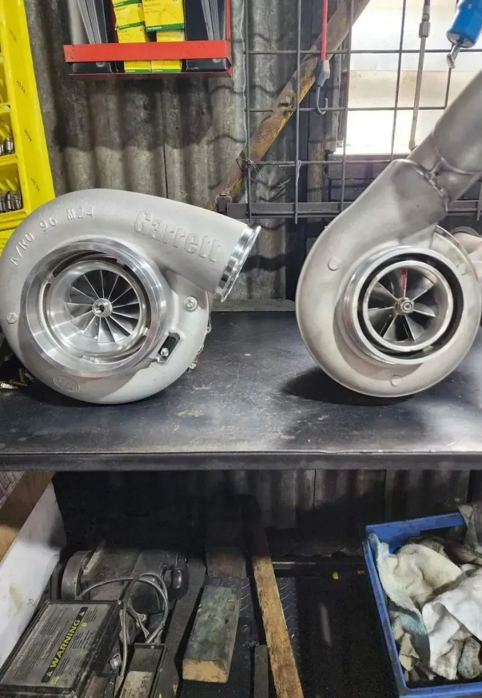 Two Turbochargers Sit on a Workbench in a Workshop — Chester's Mechanical & Performance in Tamworth, NSW