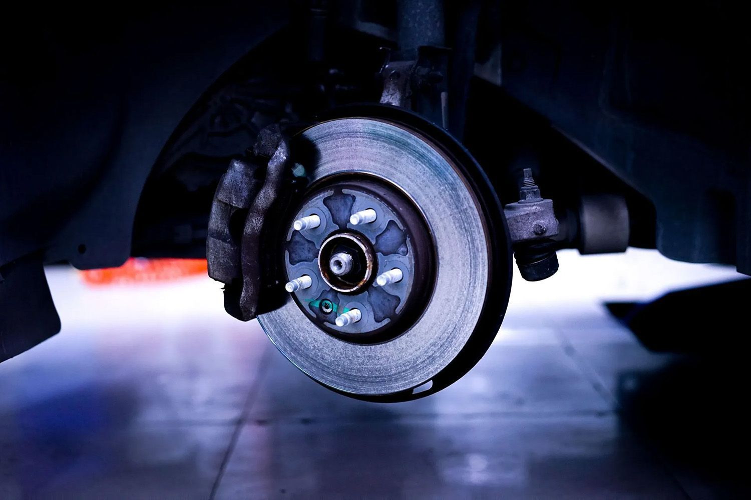 Car Brake Disc and Caliper, Close-up, Indoors — Chester's Mechanical & Performance in Tamworth, NSW