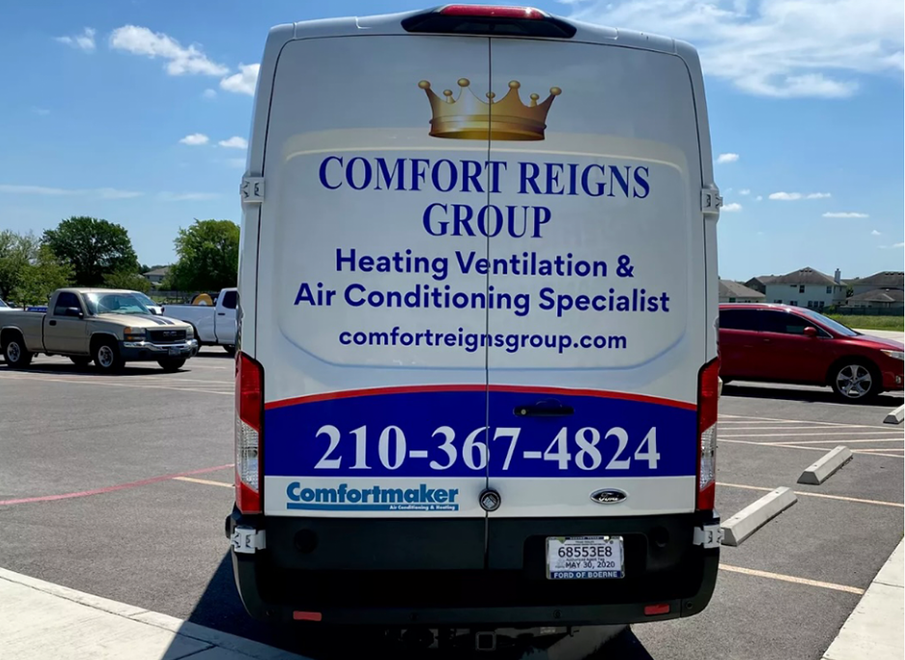 Back of a white van with Comfort Reigns Group logo, contact info, and text about HVAC services. Parked outdoors.