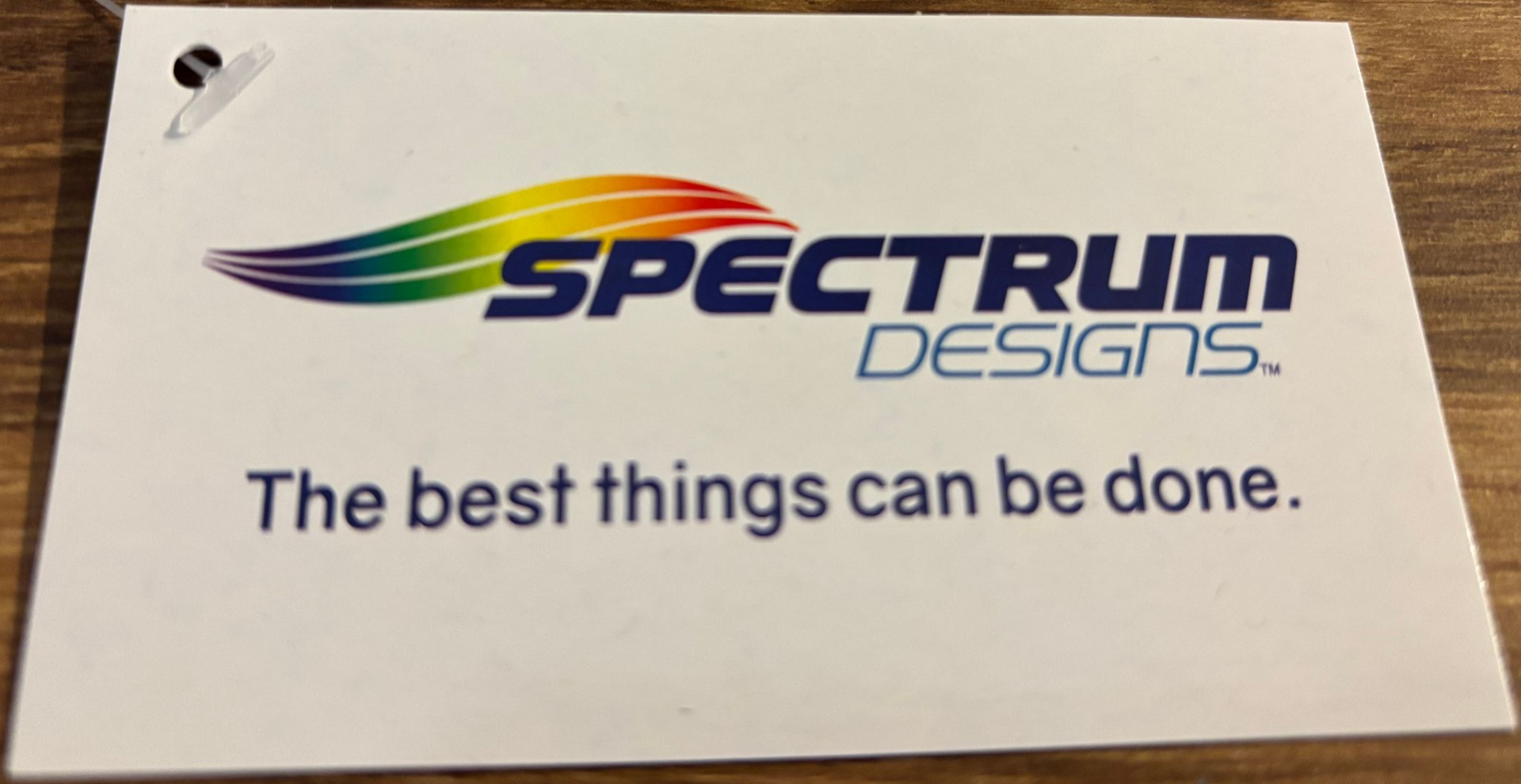 Spectrum Designs clothing tag.