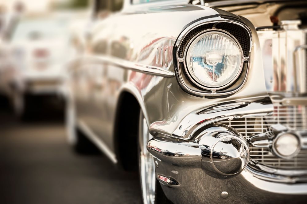 A Close Up of an Old Silver Car With the Hood Up — About Town Windscreen Repairs & Replacements in Wulguru, QLD