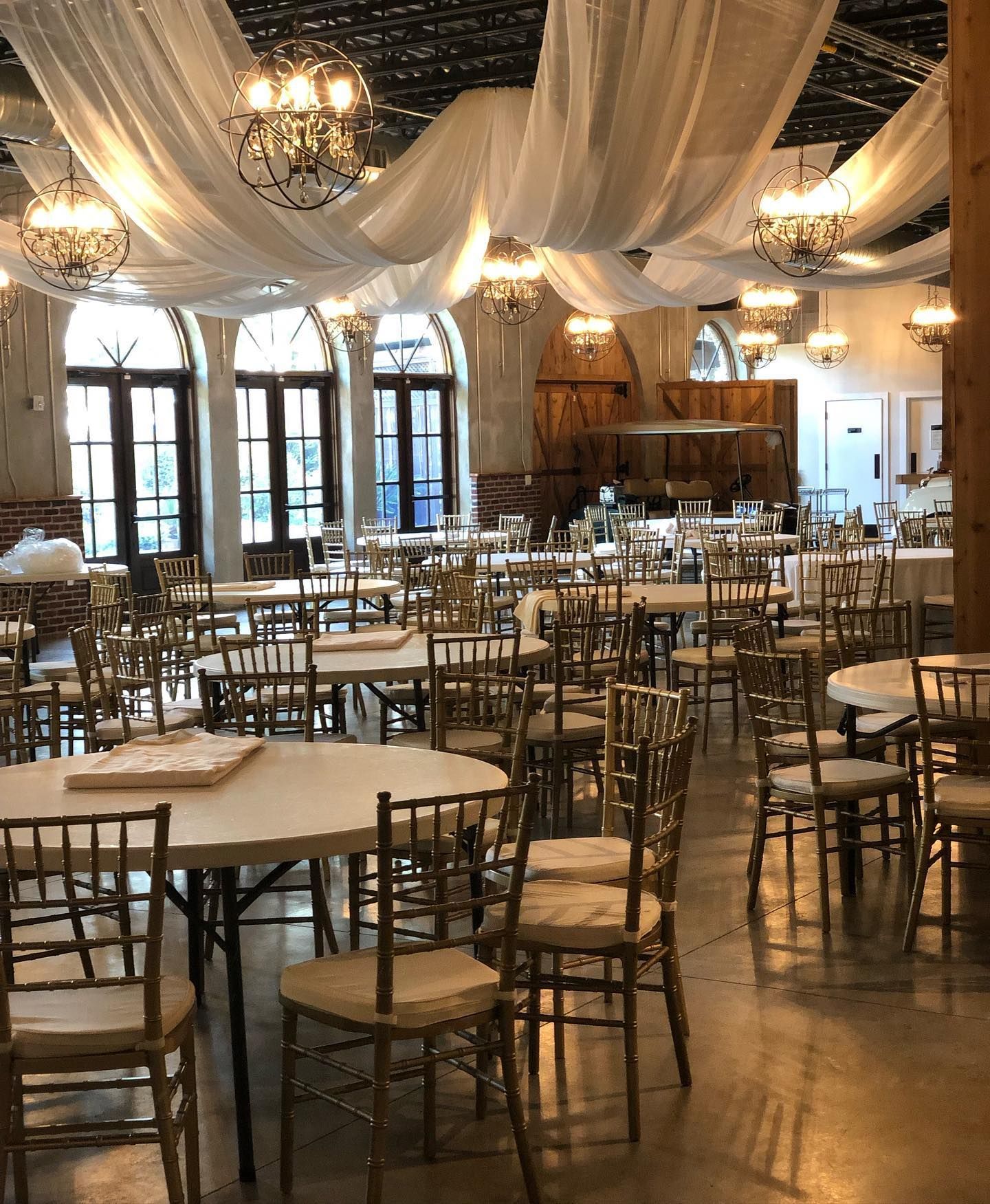 A large room with tables and chairs in it