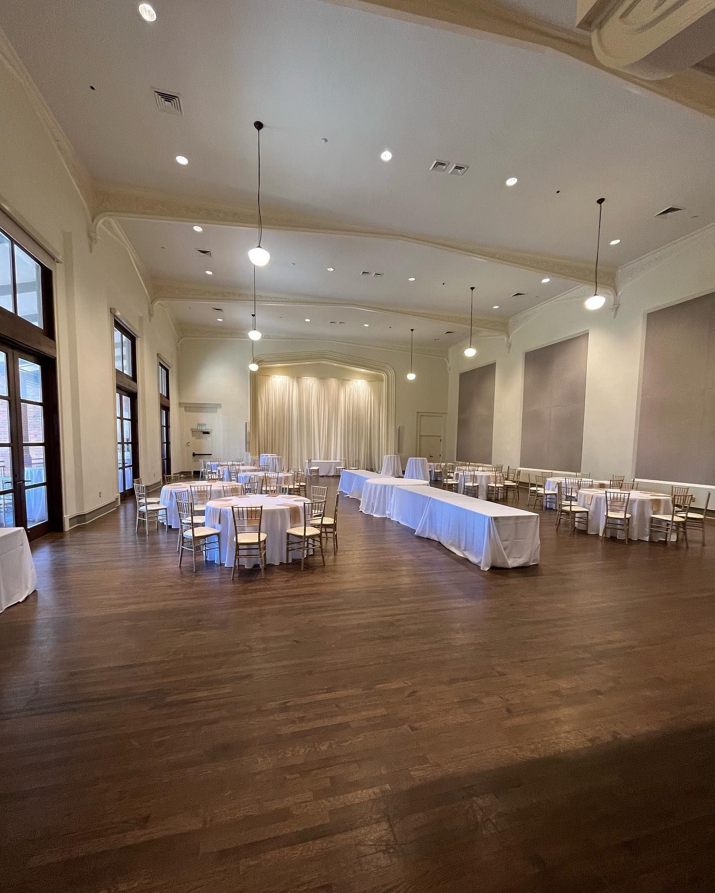 A large room with tables and chairs in it