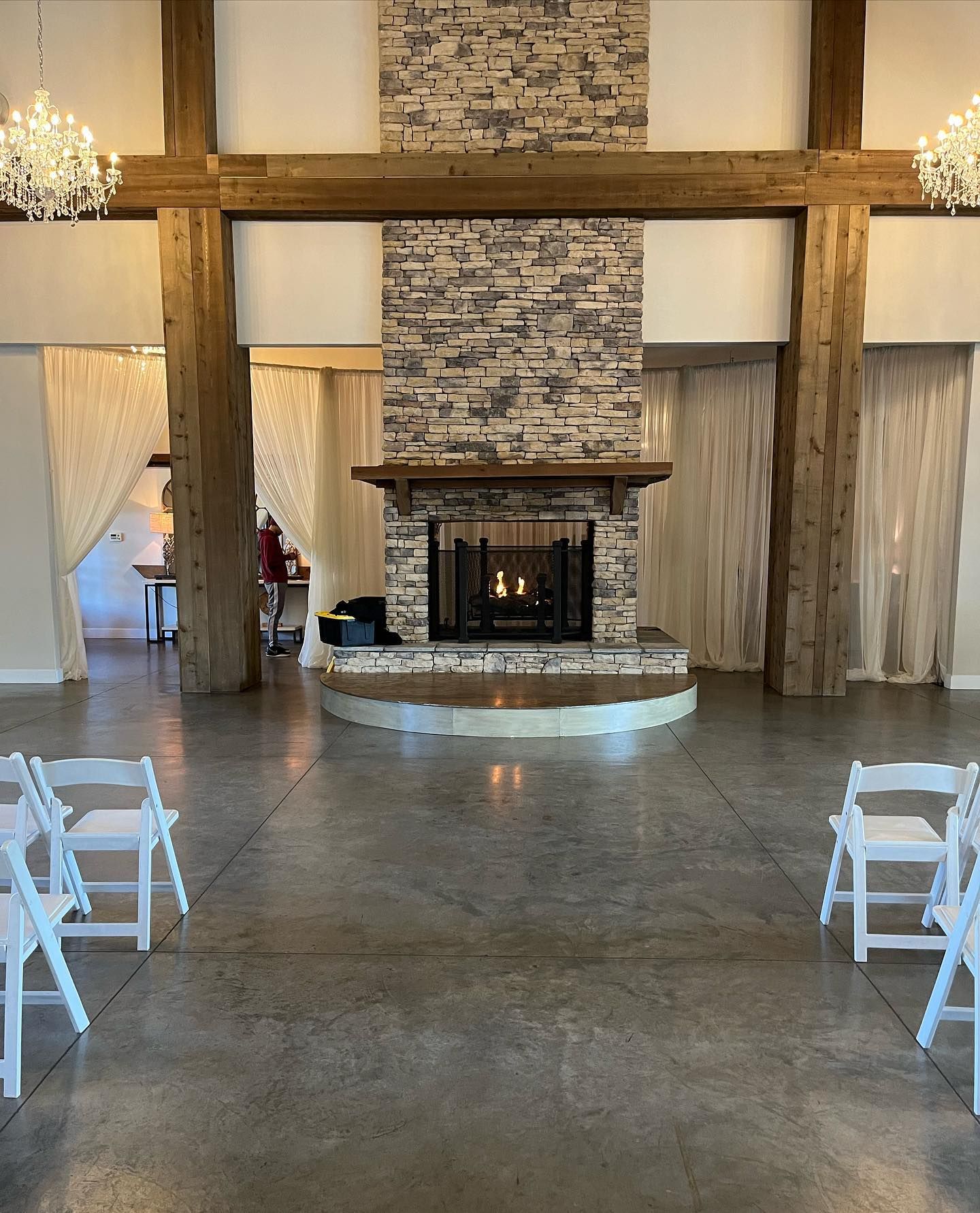 There is a fireplace in the middle of the room.