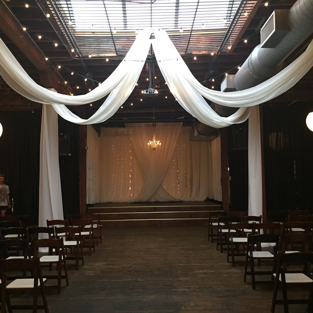 A wedding ceremony is taking place in a dark room