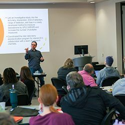Conference attendees watching a presentation