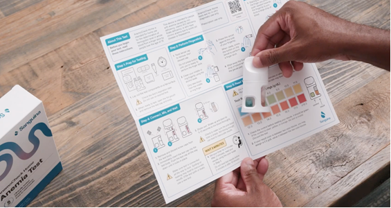 Person using an at-home anemia testing kit