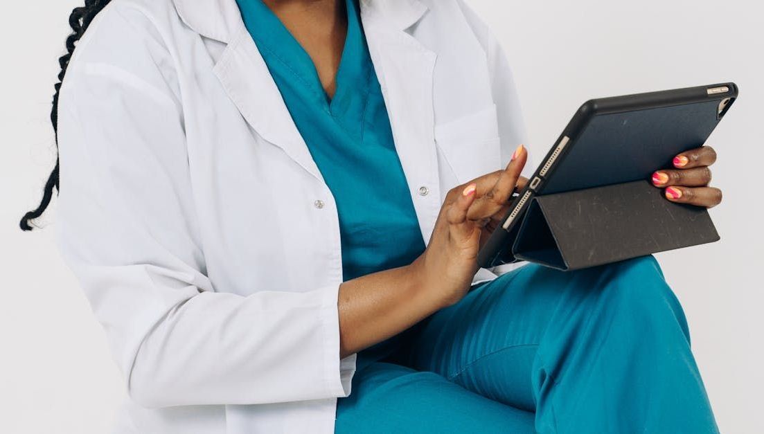 Medical professional using a tablet