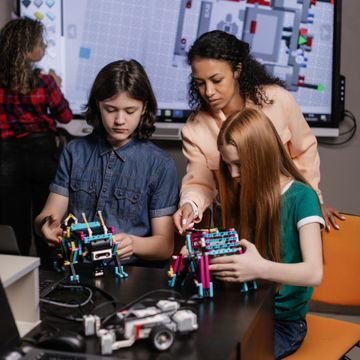 Students building robots in a classroom