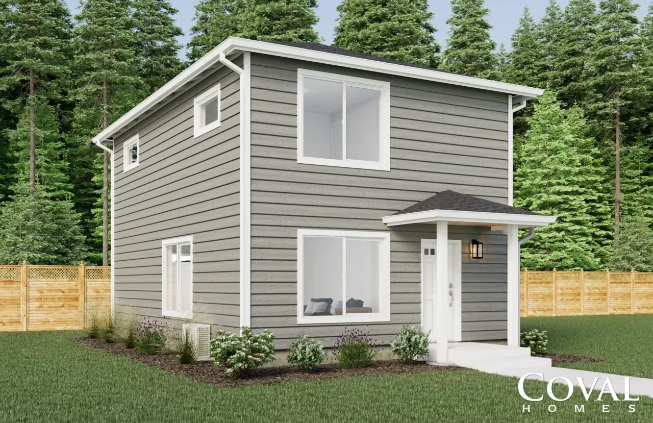 Two-story gray house with white trim, front porch, and surrounding trees and fence