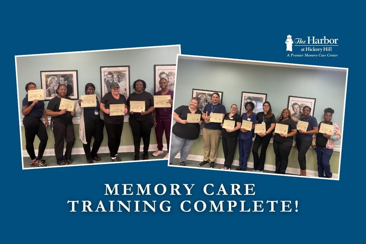A group of people standing next to each other holding certificates.