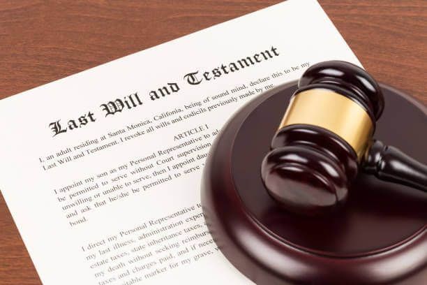 Last will and testament with wooden judge gavel document