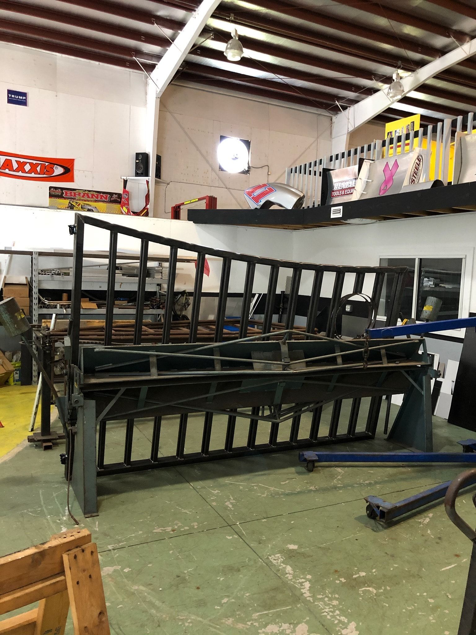 Metal fabrication machine in a workshop setting.