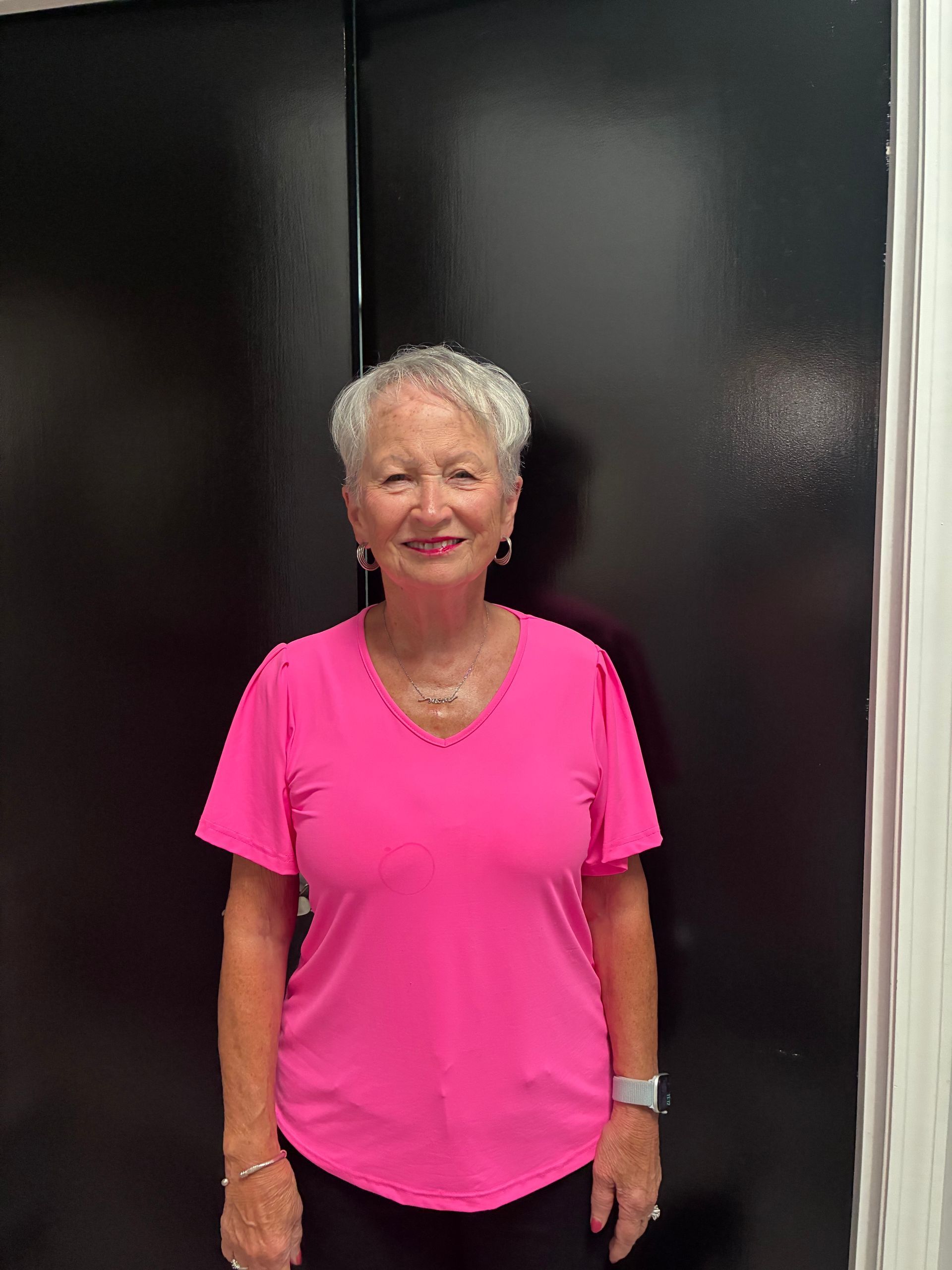 A gray circle with a white silhouette of a person in it.