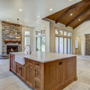contemporary kitchen sink and fireplace on background