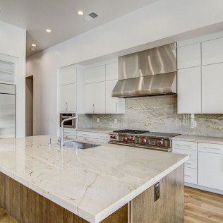 contemporary kitchen sink with white marble top
