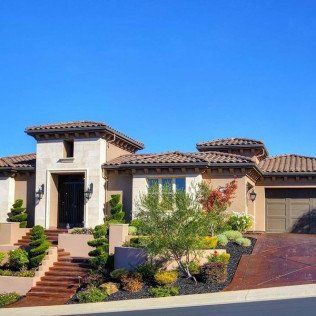exterior view of house with garage and beautiful landscape